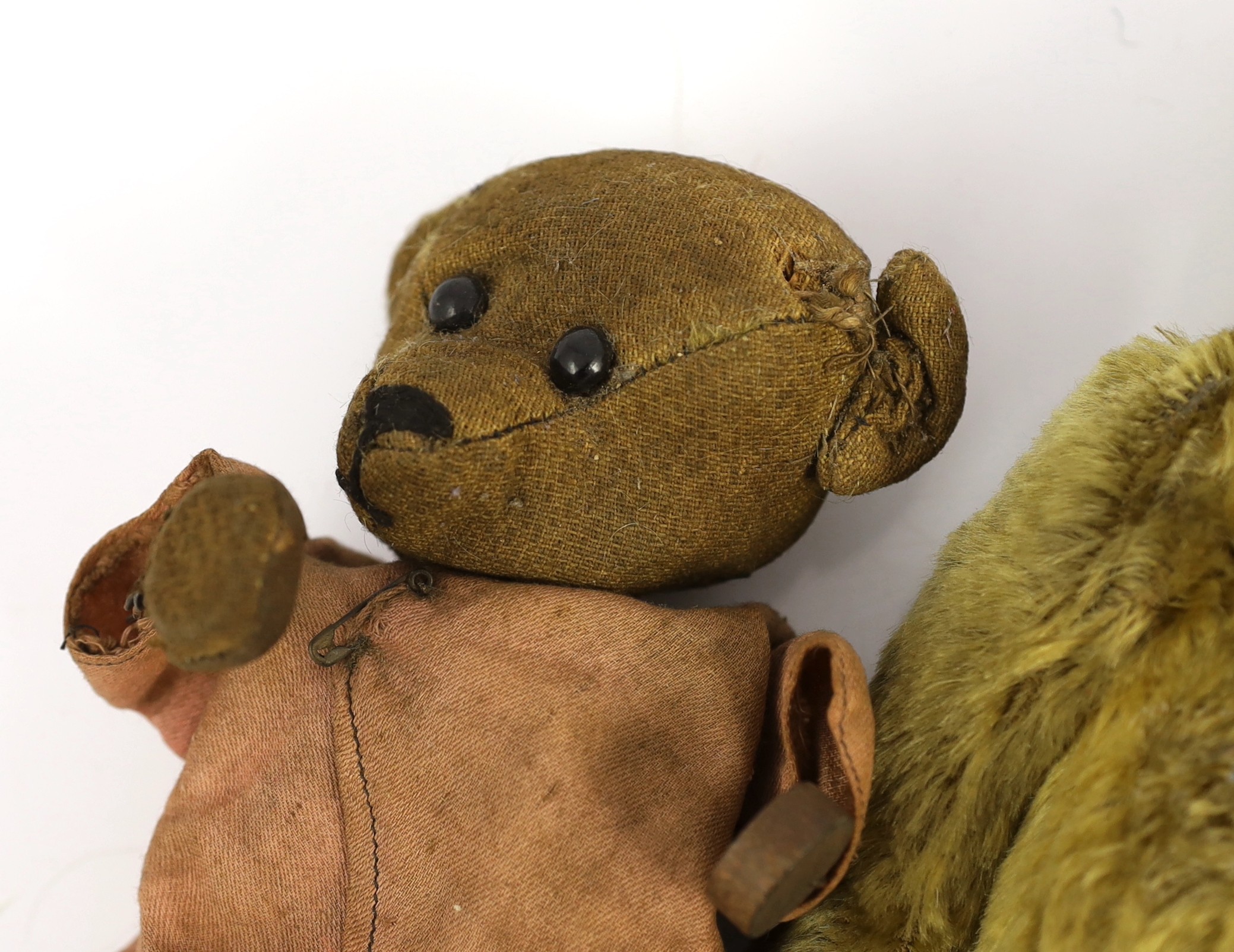 An early 20th century German Teddy bear, mohair plush and boot-button eyes, 12in., and two other Teddy bears